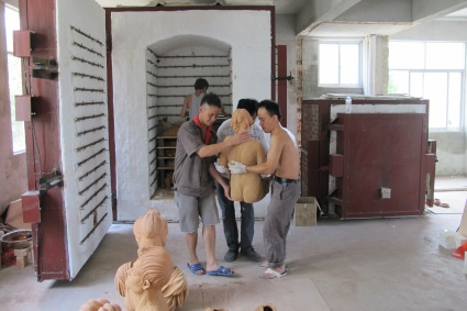 Loading the kiln with Studio Nong work at the PHuyai QunZhou NiXing Pottery Fasctory 2013